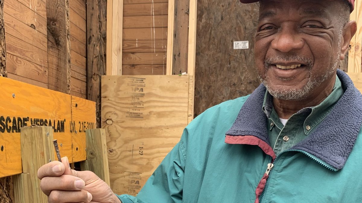 Al Beatty, president of the Cedar Hill/West Bank Heritage Foundation, holds an old nail pulled from a rotted area of wood framing Reaves Chapel. The chapel was built in the mid-1800s by former enslaved people on the Cedar Hill Plantation and other nearby plantations.