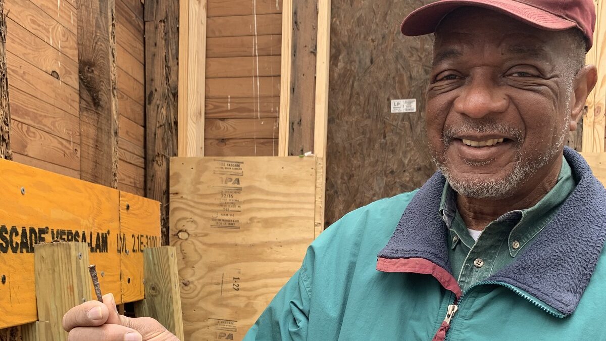 Al Beatty, president of the Cedar Hill/West Bank Heritage Foundation, holds an old nail pulled from a rotted area of wood framing Reaves Chapel. The chapel was built in the mid-1800s by former enslaved people on the Cedar Hill Plantation and other nearby plantations.