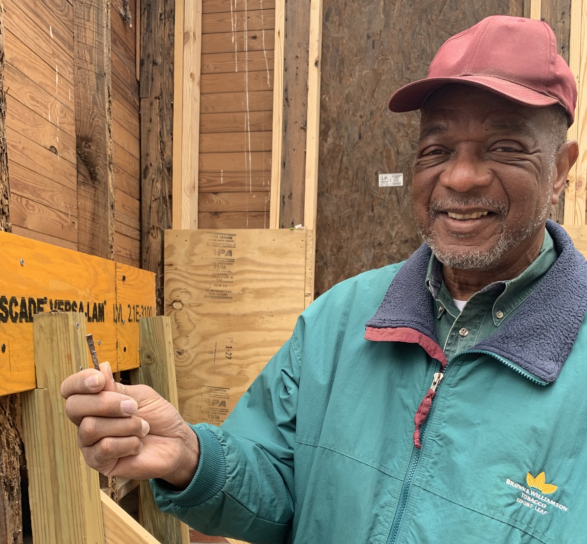 Al Beatty, president of the Cedar Hill/West Bank Heritage Foundation, holds an old nail pulled from a rotted area of wood framing Reaves Chapel. The chapel was built in the mid-1800s by former enslaved people on the Cedar Hill Plantation and other nearby plantations.