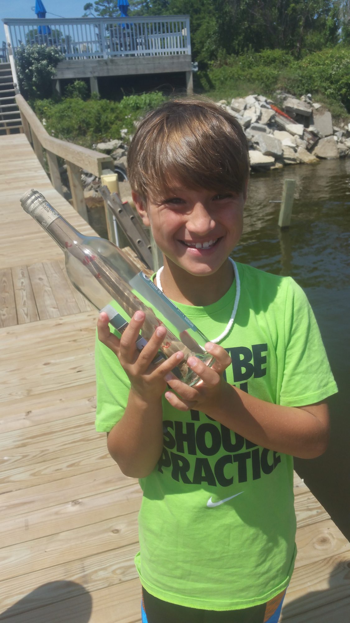  Jaxson Pszanka readies his bottled message  July 19, 2016. Photo contributed