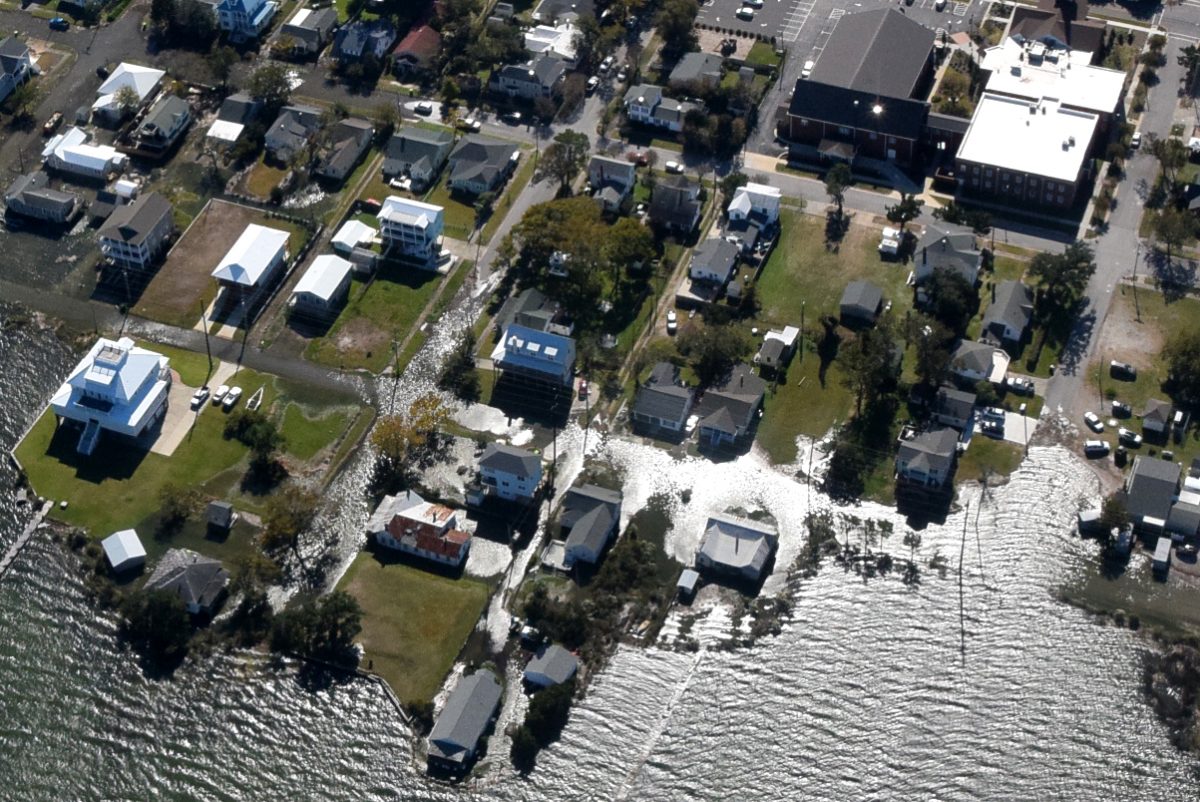 Calico Creek rises into the streets and yards of homes in Morehead City during a sunny day flood Nov. 8, 2021. Photo: Mark Hibbs/Southwings