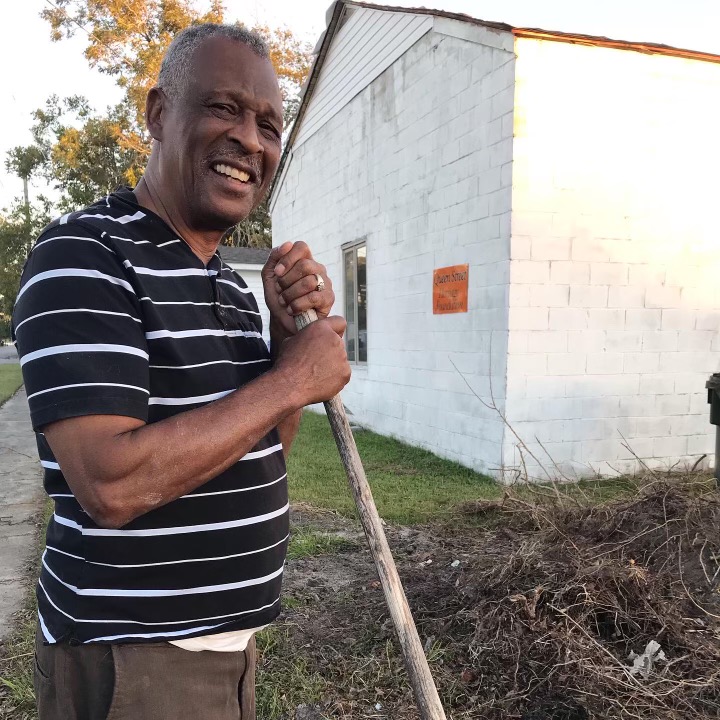  Pastor William Ellison of Queen Street Missionary Church  installs a new Civil War Trails Marker sign in front of former Queen Street High and future Queen Street Heritage Center in Beaufort. Photo: Beaufort Historical Association