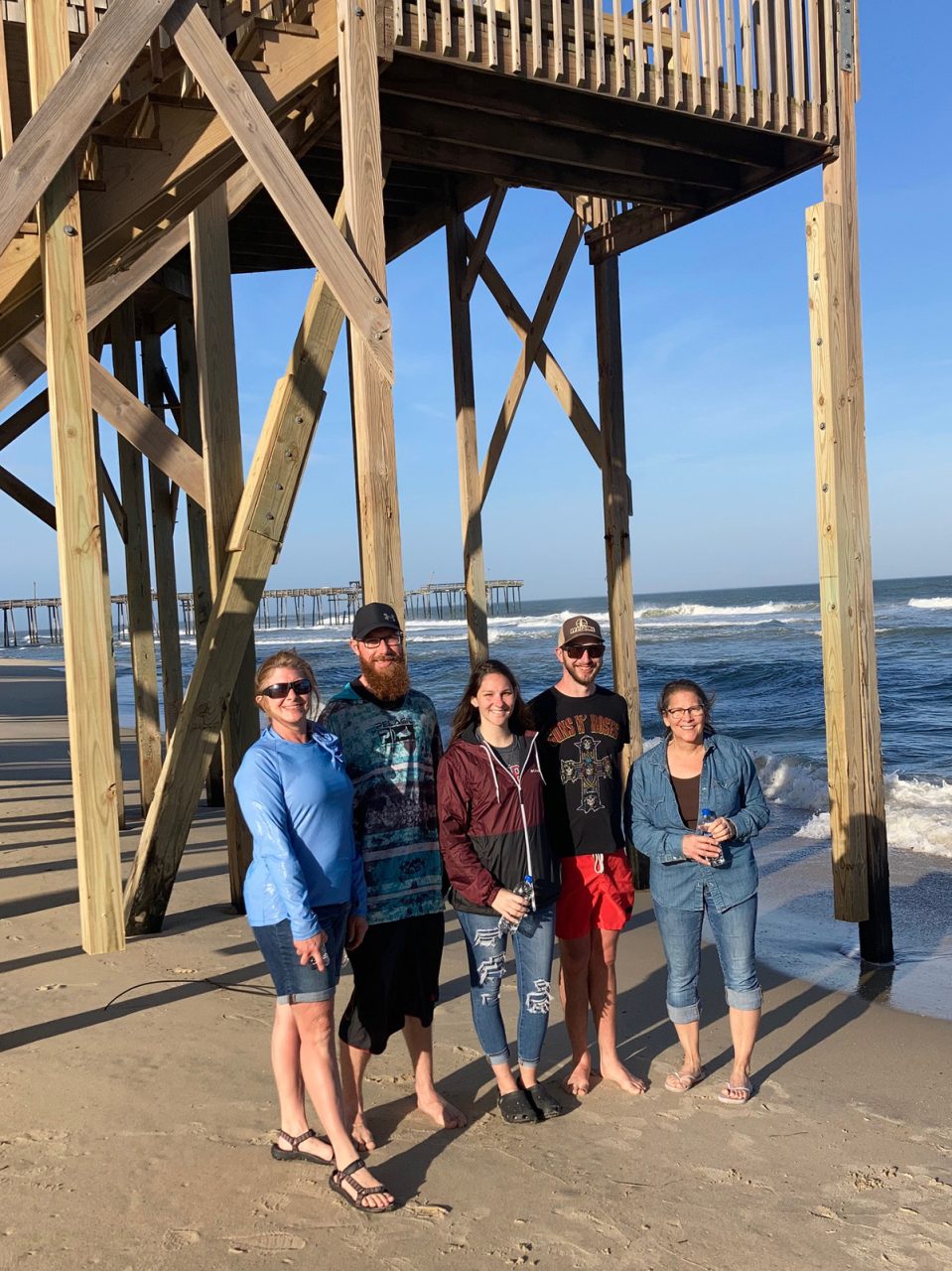 Hope Lineman, left, and her family visit Hatteras Island where several homes are threatened by the ocean. Photo: Catherine Kozak