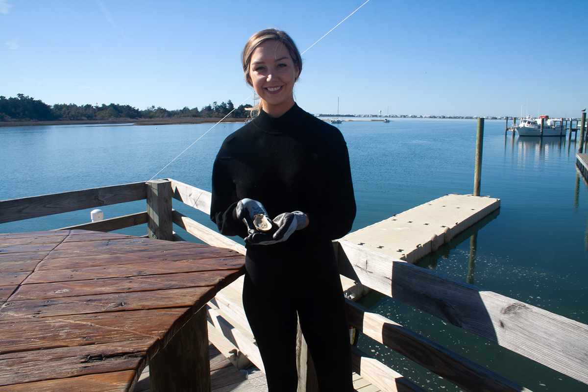 Rebekah Williams of Bekah’s Bay Oysters show off her product. Photo: Lena Beck