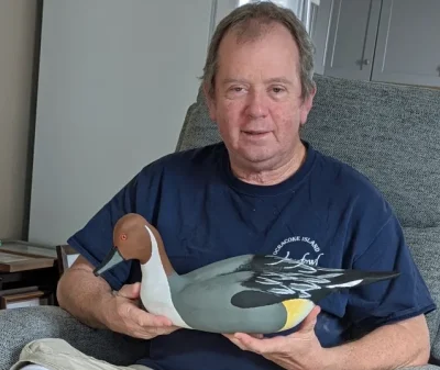 John Simpson holds his Northern Pintail carving . Photo: P. Vankevich