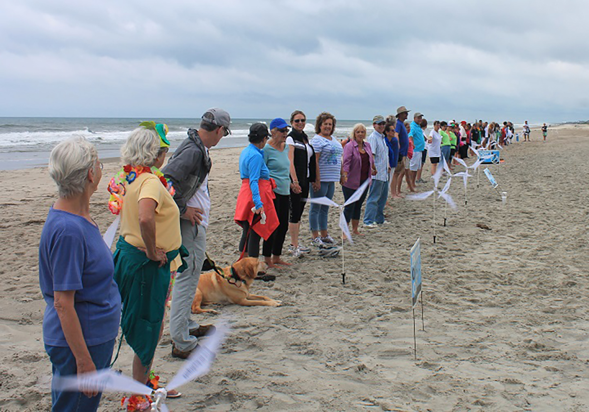 A past Hands Across the Sand in Emerald Isle. Photo: Sue Stone