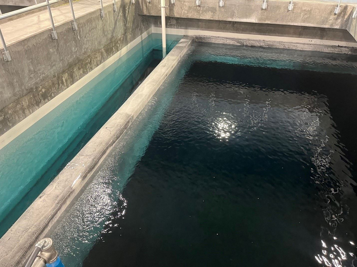 Water is shown Aug. 3 in one of eight new granular activated carbon filters during the “washing” process at the Cape Fear Public Utility Authority’s Sweeney Plant. Photo: CFPUA