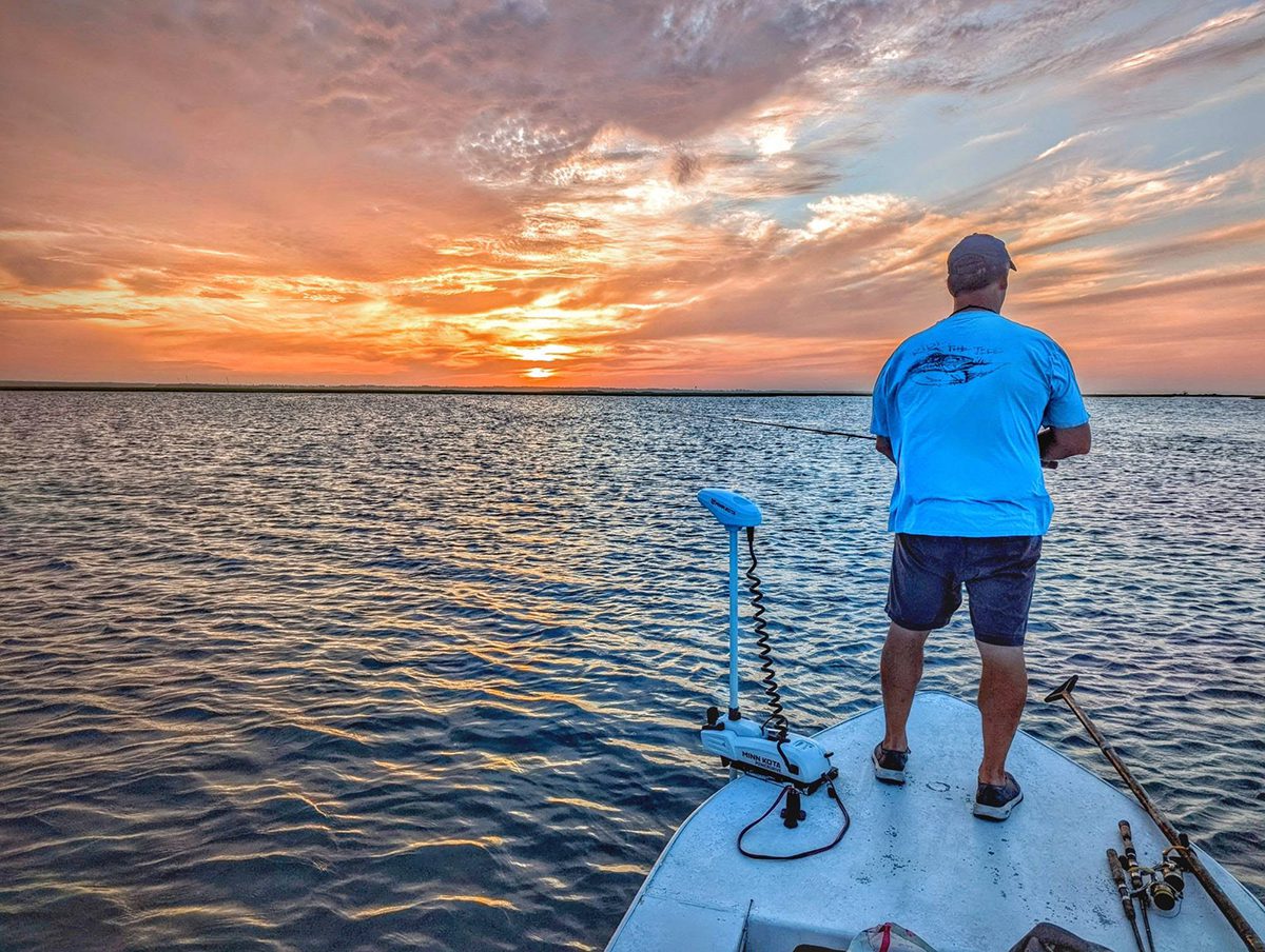 The author looks for signs of fish at dawn on a favorite flat.