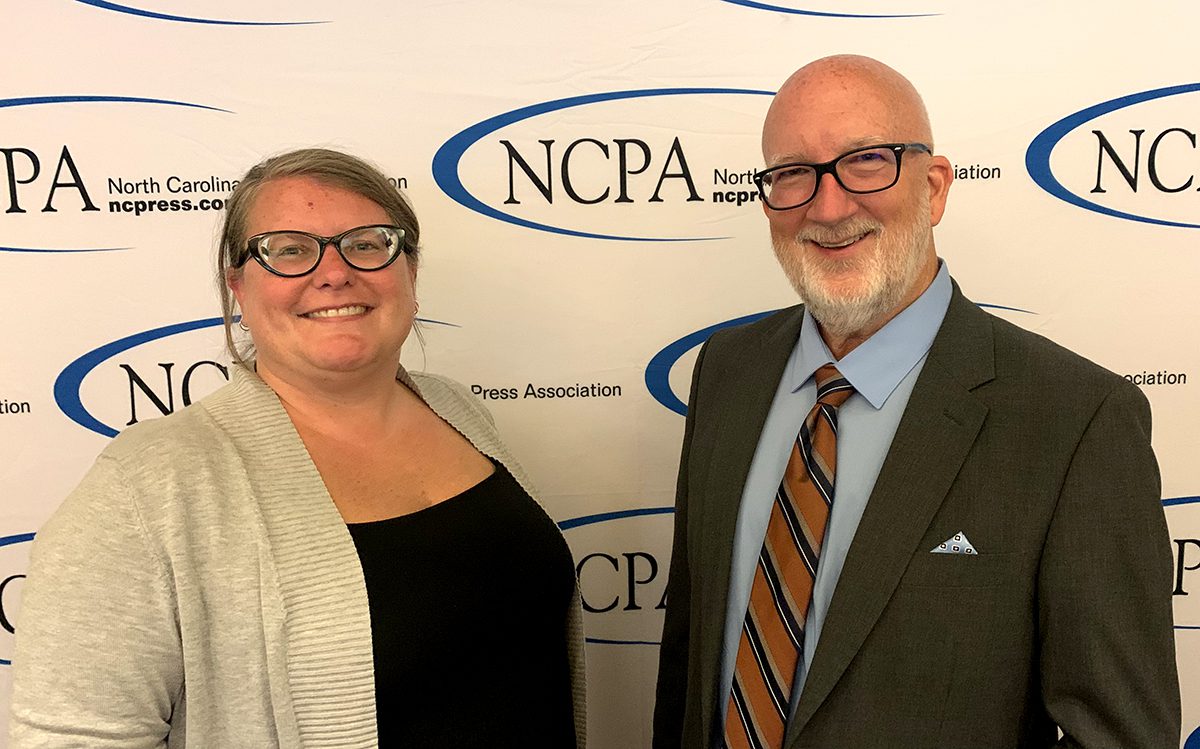 Assistant Editor Jennifer Allen, left, and Editor Mark Hibbs accepted Coastal Review's 2022 North Carolina Press Association editorial awards Thursday in Raleigh.