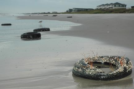 Tires like these that washed up on Bogue Banks after Hurricane Earl in 2010 and were bound together and placed offshore decades ago as artificial reefs have washed up again recently. Photo: Mark Hibbs/Carteret County News-Times