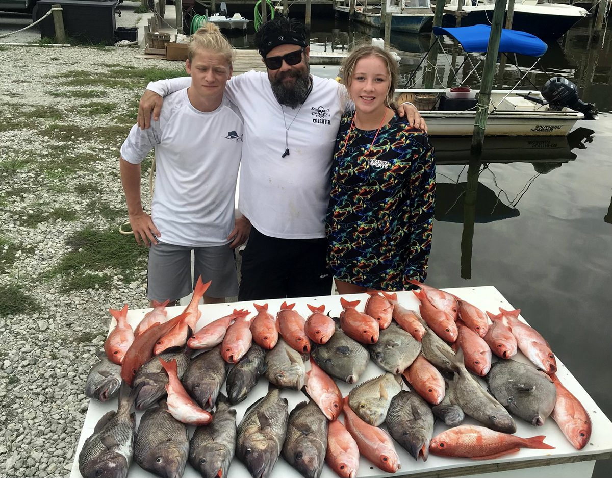 Charlie Medlin, Chris Medlin and Brooklyn Brugoto of East Coast Sports show off a nice bunch of bottom dwellers. Photo courtesy Chris Medlin.