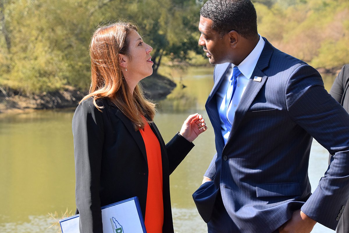 DEQ Secretary Elizabeth Biser and EPA Administrator Michael Regan chat Monday following the event on the bank of the Neuse River in Goldsboro. Photo: Mark Hibbs