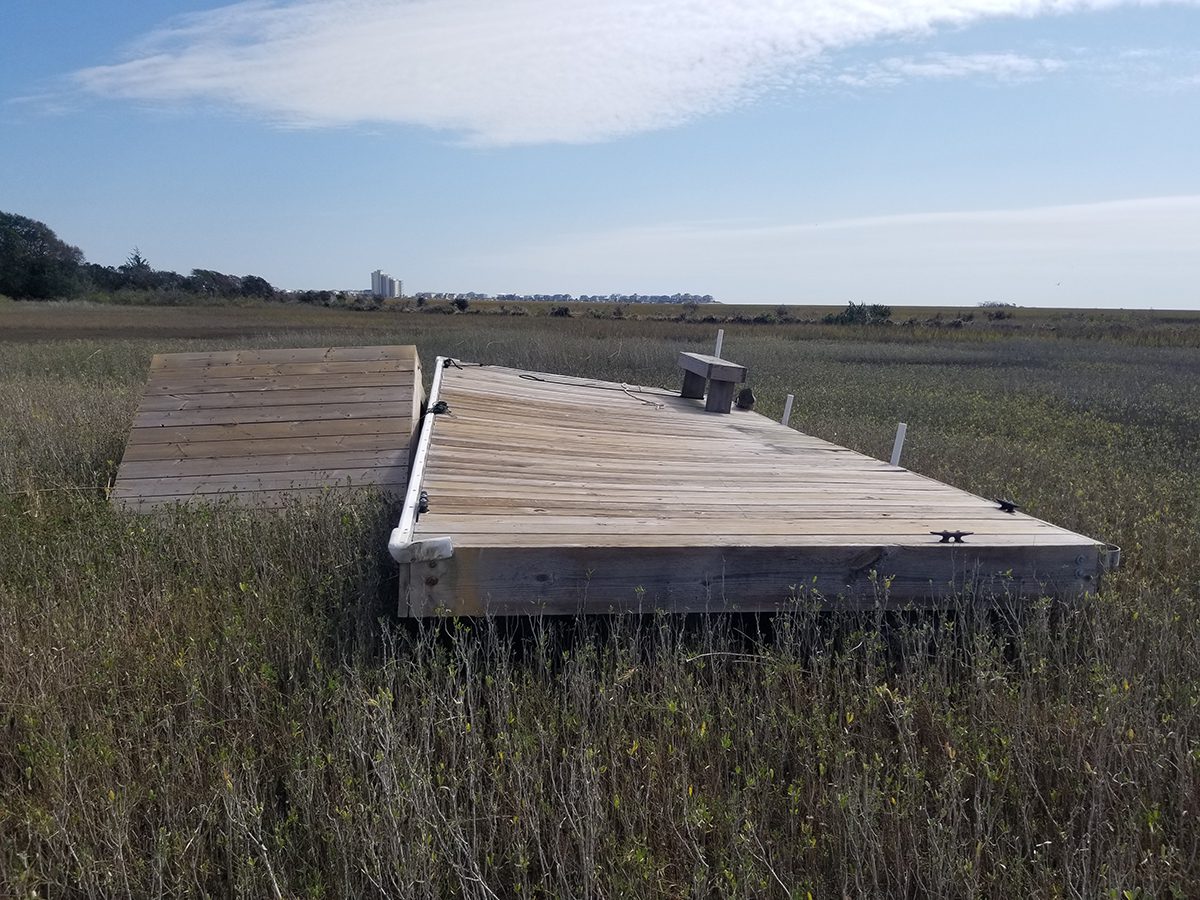 Sections of dock rest atop a marsh in Brunswick County following Hurricane Ian earlier this month. Photo courtesy of Joe Huie.