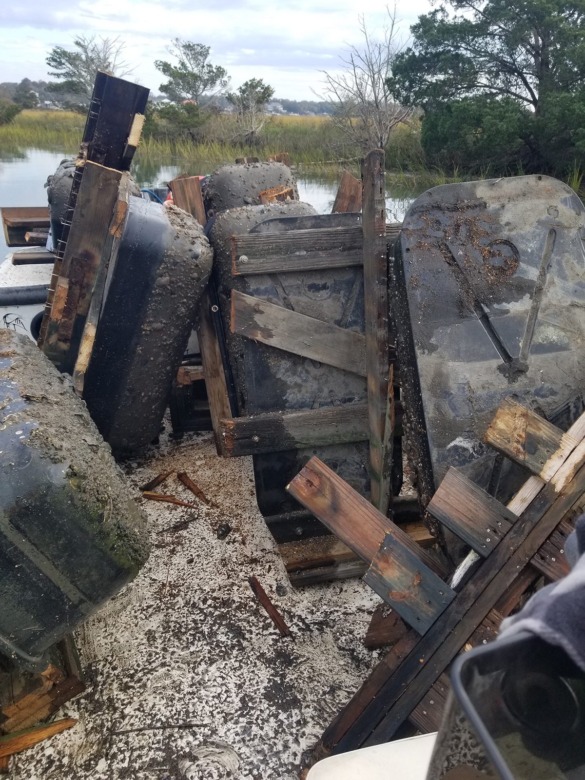 A pile of mangled debris from a floating dock is shown in a Brunswick County marsh. Photo courtesy of Joe Huie.