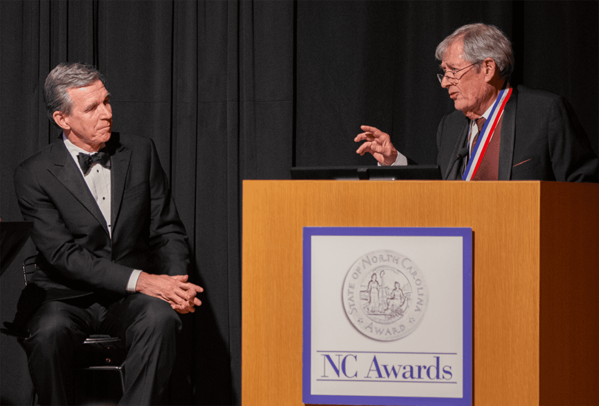 Gov. Roy Cooper, left, and Dr. Stan Riggs are shown at the 2022 North Carolina Awards presentation, Nov. 15 in Raleigh. Photo: Contributed