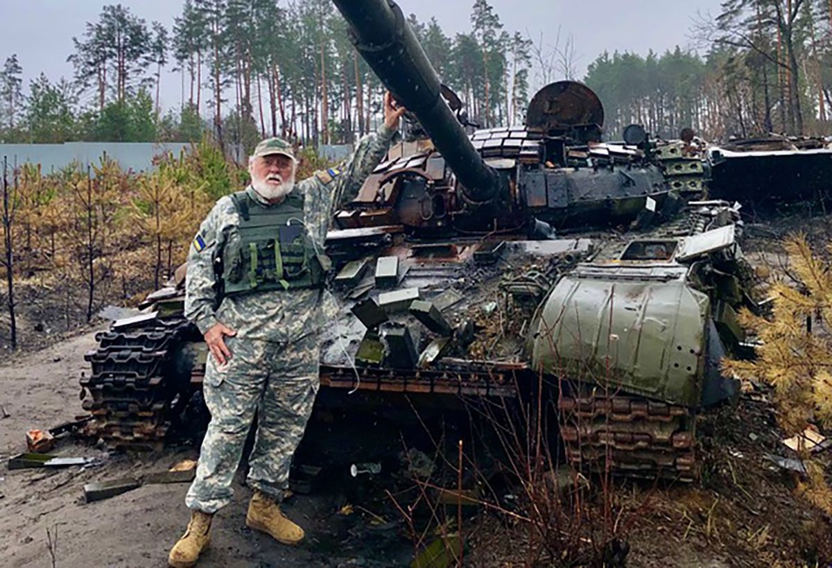 Randy Sturgill poses with a captured Russian tank on a back road between Bucha and Kyiv, Ukraine. Photo: Contributed