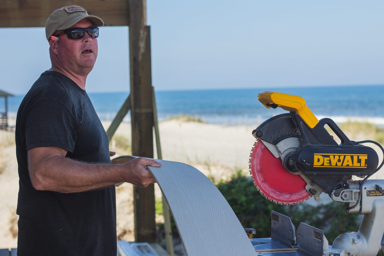 Steve Grout, a Carova resident and carpenter, works on a construction site at Swan Beach. Photo: Josee Molavi