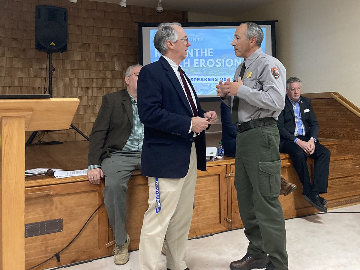 Dare County Manager Bobby Outten, left, chats with Cape Hatteras National Seashore Superintendent Dave Hallac Jan. 18 at the community meeting hosted by the county. Photo: Catherine Kozak