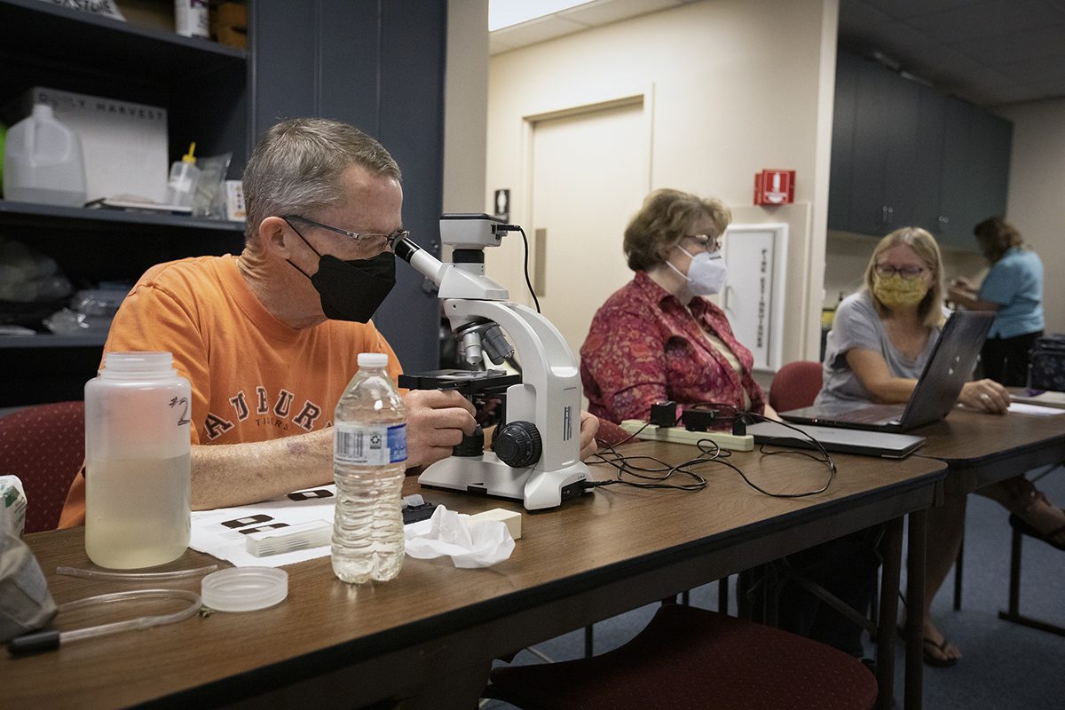 Members of CEEG analyze water samples to be sent to National Centers for Coastal Ocean Science phytoplankton monitoring network. Photo: Megan May