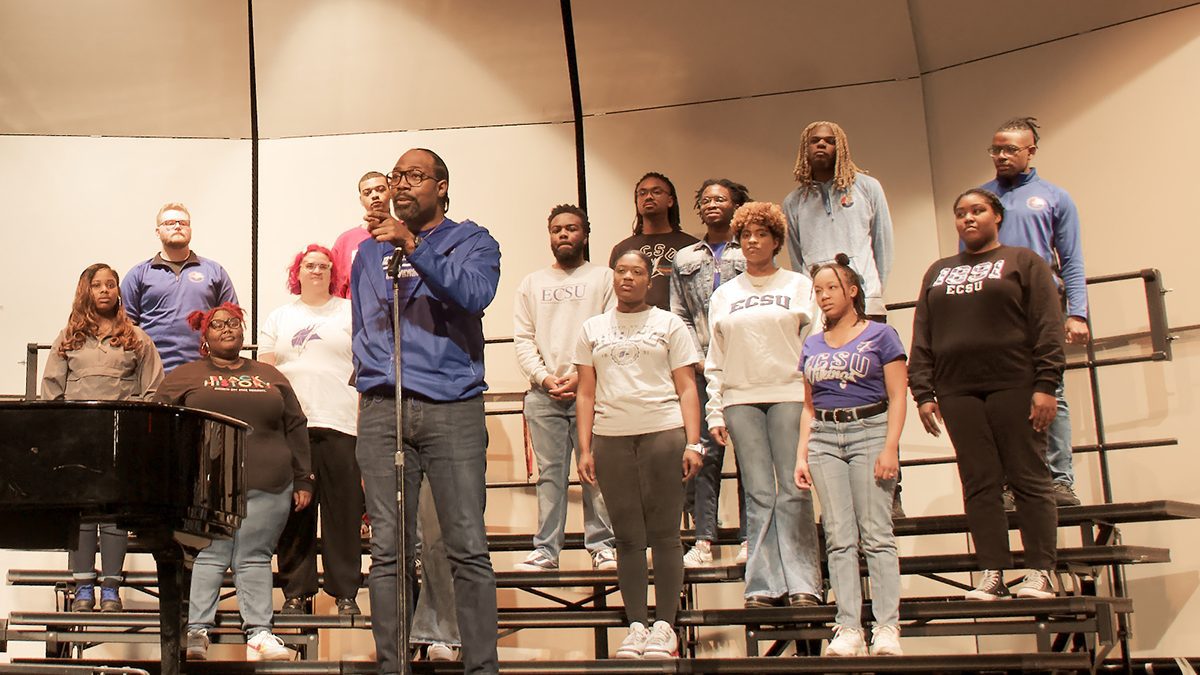 Director Dr. Walter Swan introduces the Elizabeth City State University Choir at its performance Jan. 14 in Kill Devil Hills during a celebration of Martin Luther King's birthday. Photo: Kip Tabb