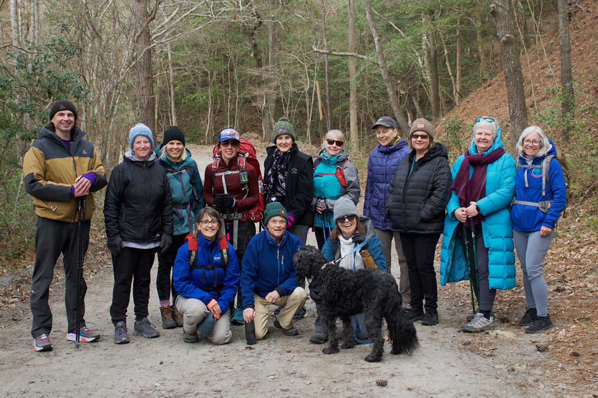 Luke Halton, far left, poses with members of the OBX Women's Adventure Club on Old Nags Head Woods Road, part of the Jockey's Trail network. Photo: Kip Tabb