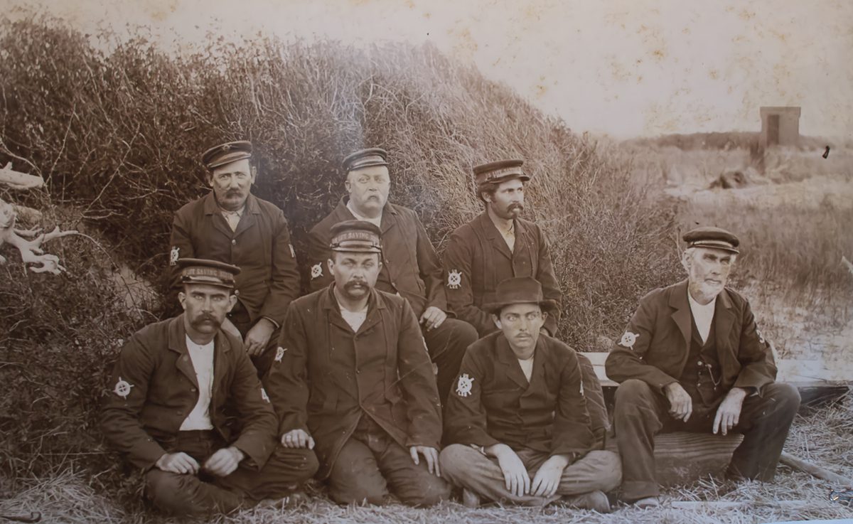 The original black and white photo of the 1910 lifesaving crew at New Inlet Station. Photo: The Outer Banks History Center collection