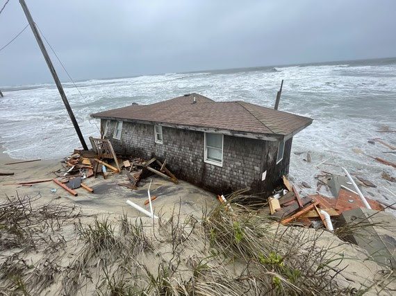 Photo of collapsed one-story house at 23228 East Point Drive, Rodanthe, Photo: NPS