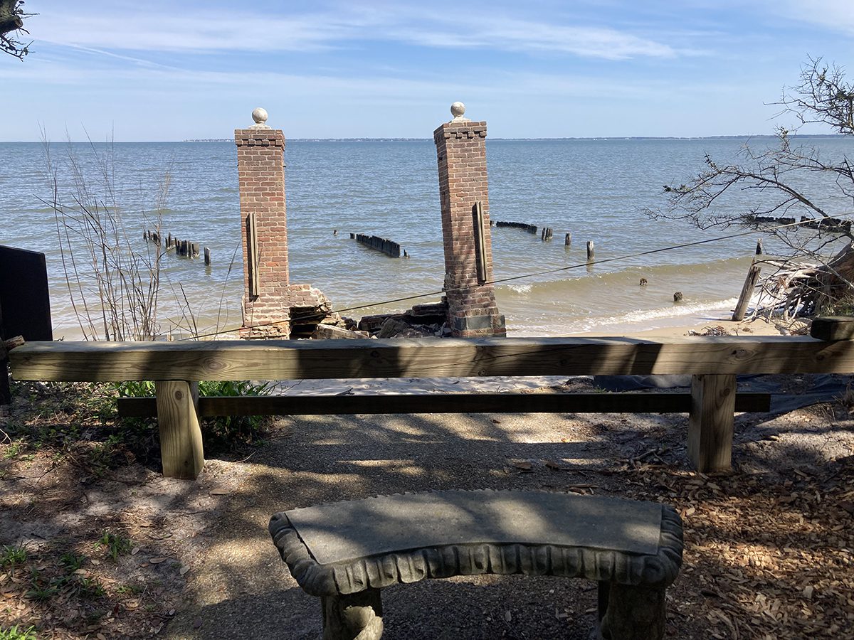 A view of the erosion at the Elizabethan Gardens where a garden bench overlooks the remains of the park's former Colonists' Gate. Photo: Catherine Kozak