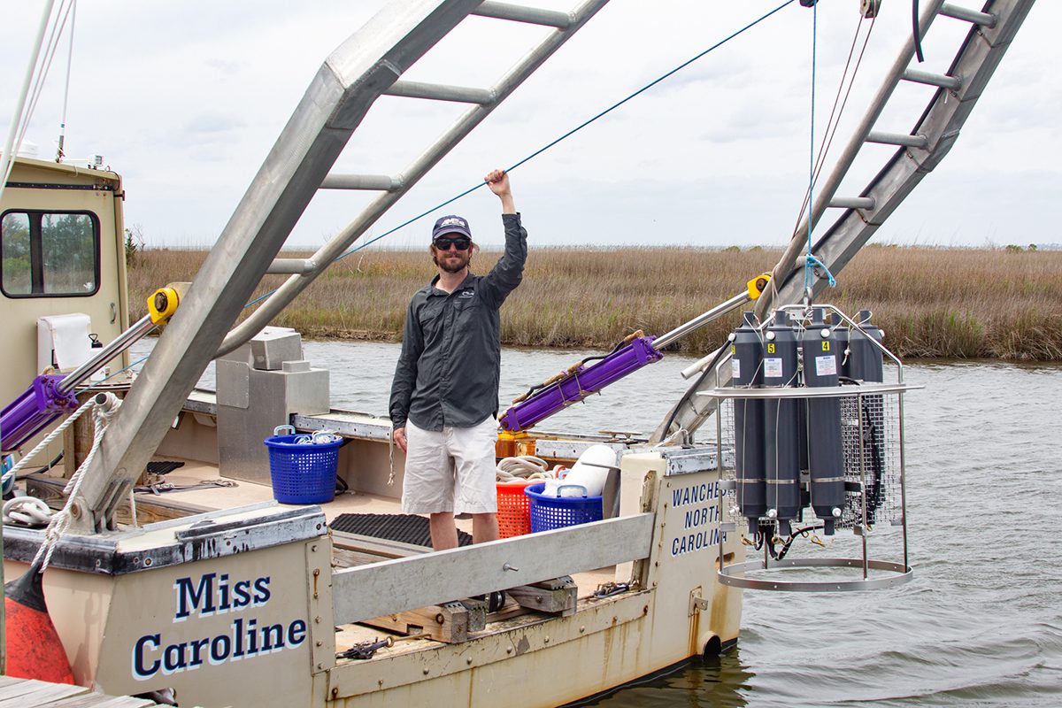 Trip Taylor, a CSI assistant scientist, stands onboard the dedicated research vessel, Miss Caroline. Photo: Corinne Saunders