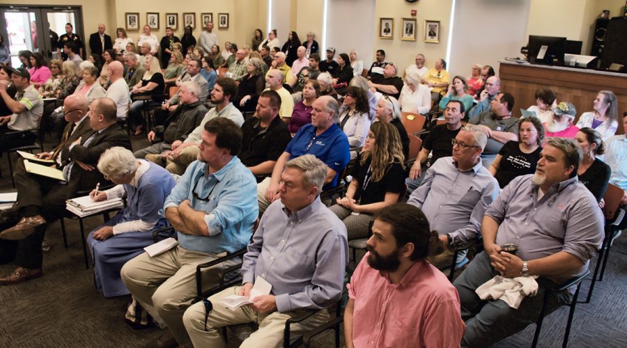 A large portion of the more than 100 people who attended the Dare County Board of Commissioners meeting Monday were opposed to a proposed 60-home cluster development in Wanchese. Photo: Kip Tabb