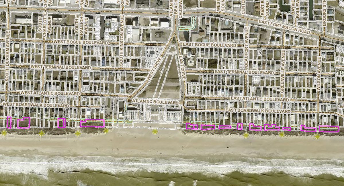 James Anthony Bunn says he now owns more than a dozen parcels in Atlantic Beach, shown here with magenta borders, oceanward of beach houses and condominiums to the east and west of the boardwalk at the former amusement circle. Image: Carteret County GIS