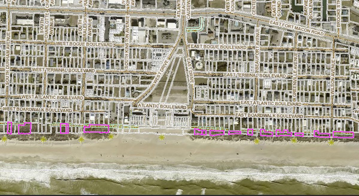 James Anthony Bunn has registered quitclaim deeds for more than a dozen parcels in Atlantic Beach, shown here with magenta borders, oceanward of beach houses and condominiums to the east and west of the boardwalk at the former amusement circle. Image: Carteret County GIS