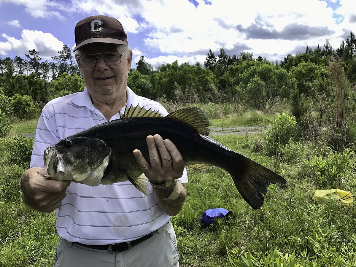 Don Churchill shows off his golf course catch. Photo: Gordon Churchill