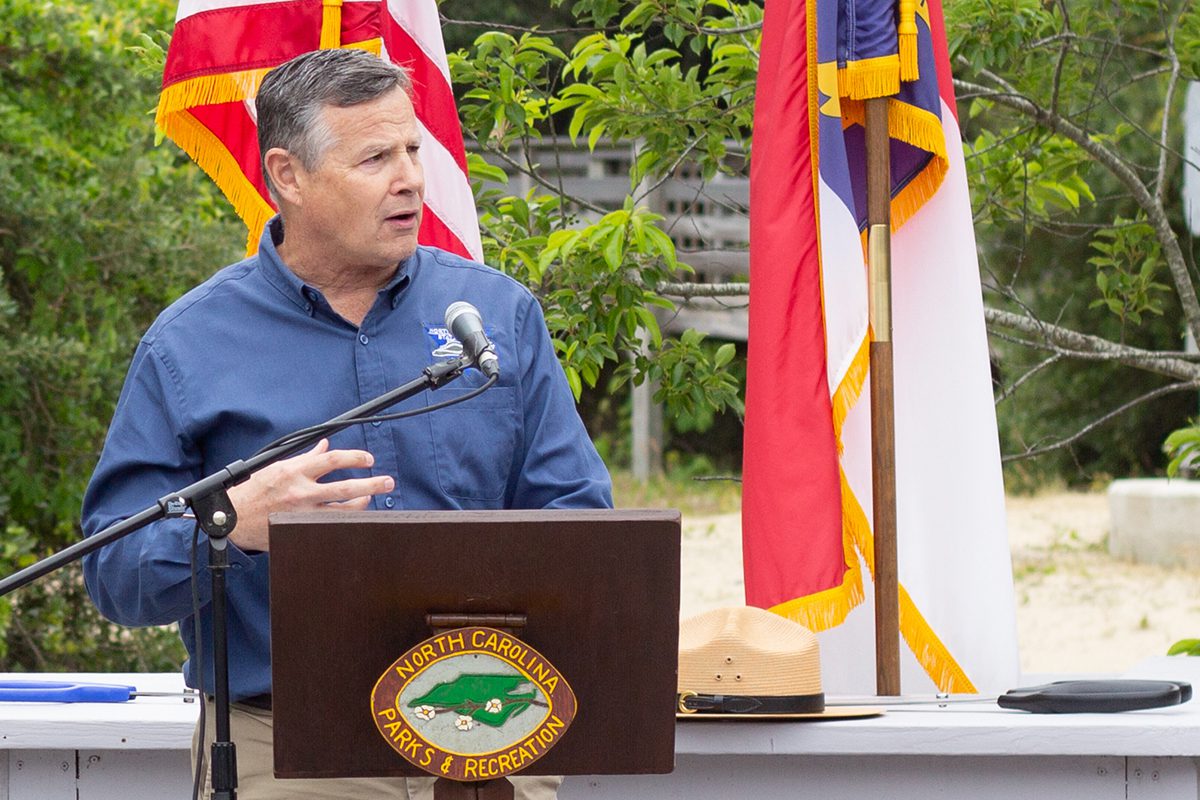 Brian Strong, interim director of the North Carolina Division of Parks and Recreation, notes Jockey's Ridge State Park's distinction as one of the most-visited state parks during the May 25 ribbon cutting ceremony. Photo: Corinne Saunders