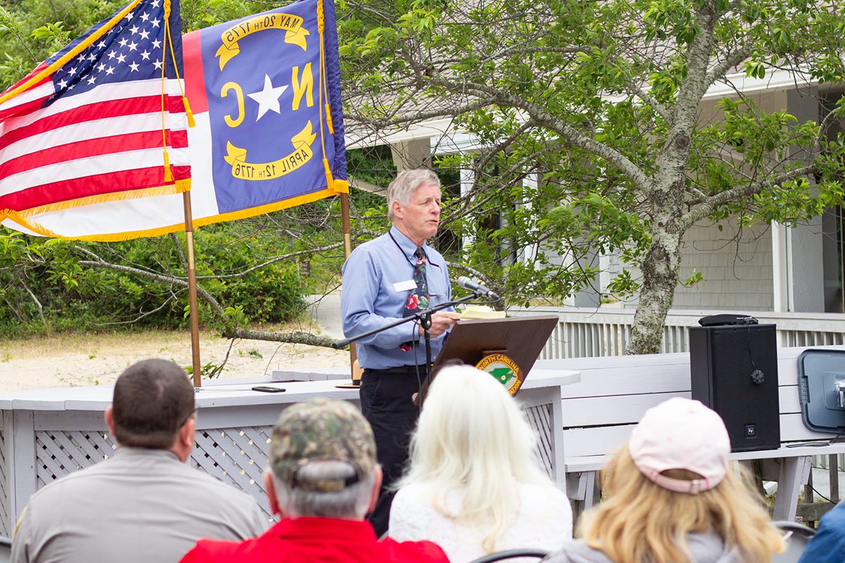 Mike O’Brien, Friends of Jockey’s Ridge board chair, shares a brief history of the nonprofit at the May 25 ribbon-cutting ceremony at Jockey’s Ridge State Park. Photo: Corinne Saunders