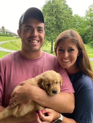 Josh and Heidi Helms pose with their dog Beacon when he was a pup. Photo: Contributed