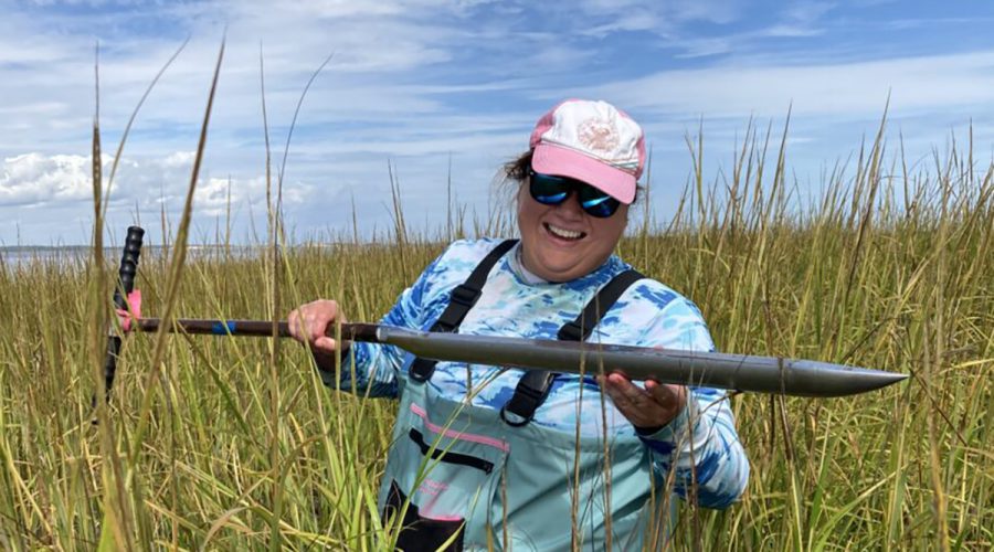 Mariko Polk conducts fieldwork in a salt marsh. Photo: North Carolina Sea Grant