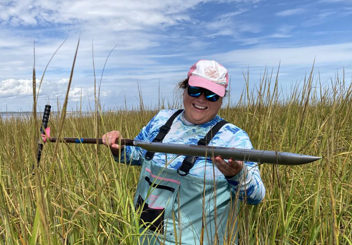 Mariko Polk conducts fieldwork in a salt marsh. Photo: North Carolina Sea Grant