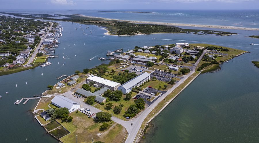Boats dot the Carteret County waters of, from left, Gallants Channel, Taylors Creek and Bulkhead Channel Thursday, with, in the foreground, Pivers Island, home to the National Oceanic and Atmospheric Administration Beaufort Laboratory and the Duke University Marine Lab; Front Street in Beaufort at top left; the Rachel Carson Reserve, center-left; Shackleford Banks, top-center; and the Atlantic Ocean beyond. Photo: Dylan Ray