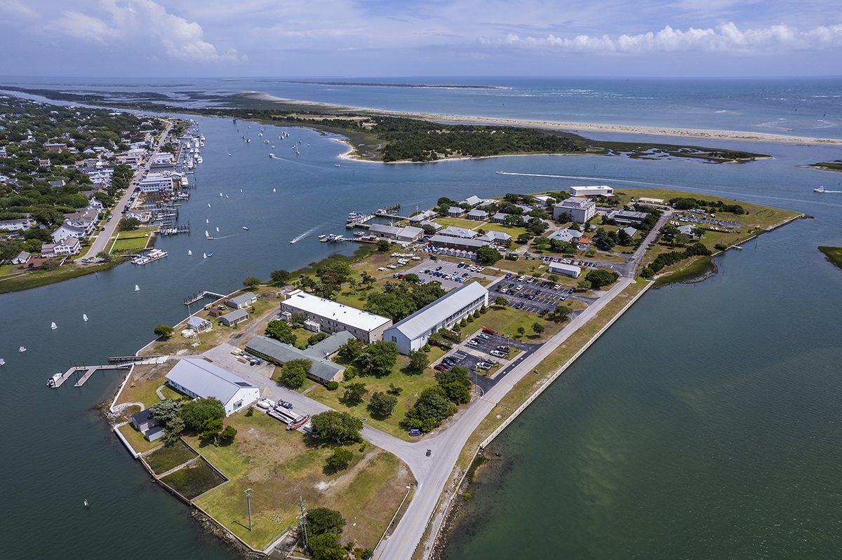 Boats dot the Carteret County waters of, from left, Gallants Channel, Taylors Creek and Bulkhead Channel Thursday, with, in the foreground, Pivers Island, home to the National Oceanic and Atmospheric Administration Beaufort Laboratory and the Duke University Marine Lab; Front Street in Beaufort at top left; the Rachel Carson Reserve, center-left; Shackleford Banks, top-center; and the Atlantic Ocean beyond. Photo: Dylan Ray