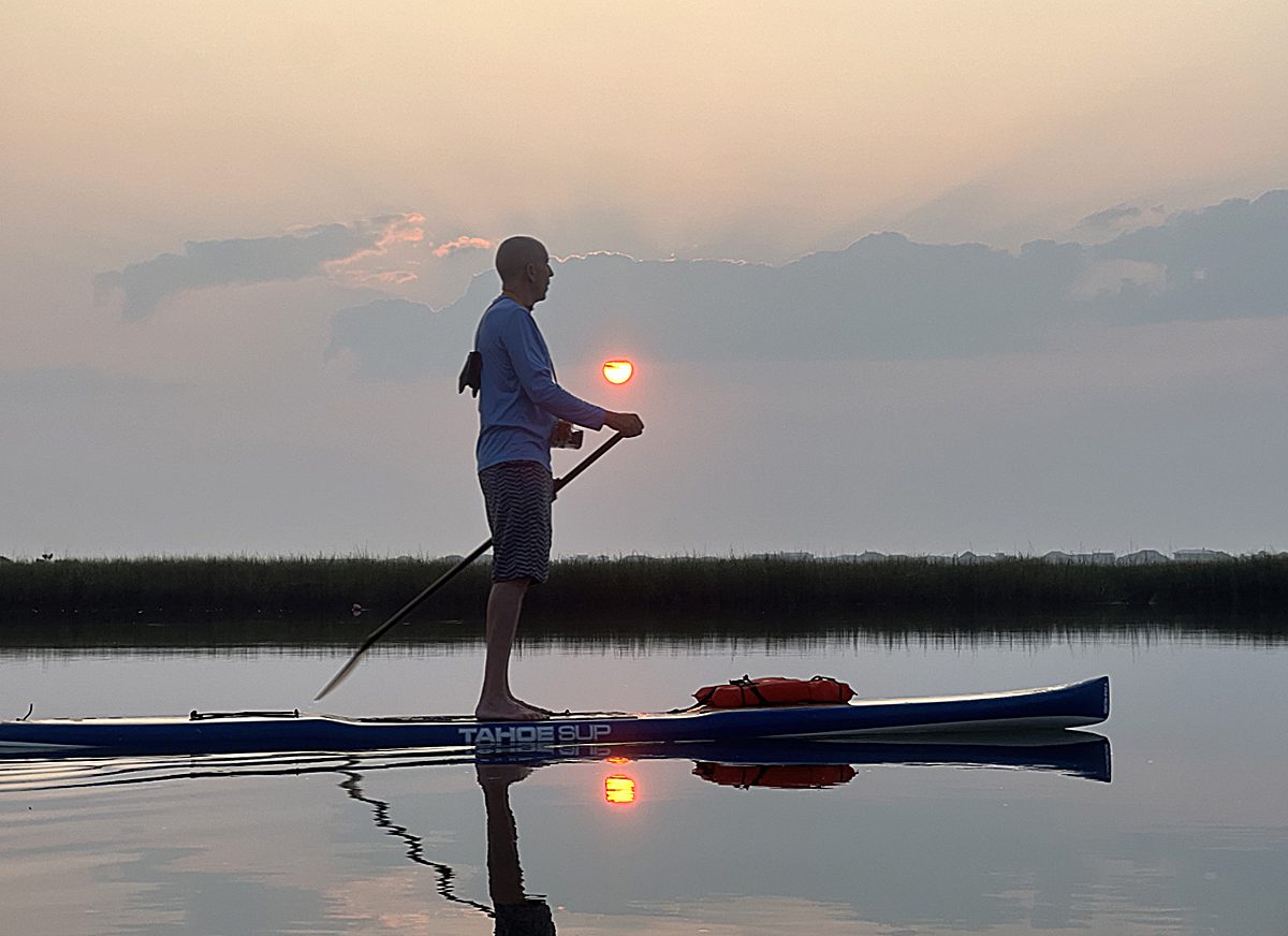 Sunset fishing with a cap and camera - Spotlight News Magazine