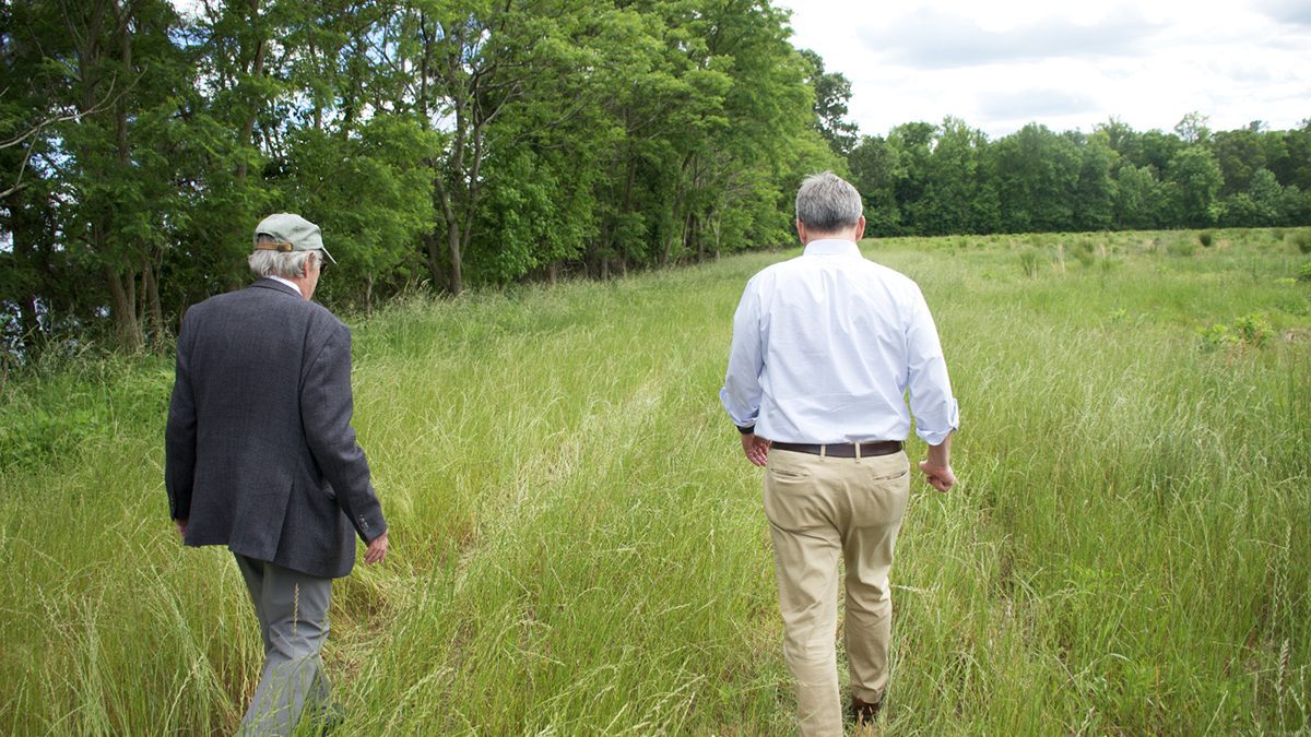 Retired East Carolina University geologist Dr. Stan Riggs, left, and Attorney General Josh Stein discuss the ecological and geographic history of the Tall Glass of Water site in Bertie County during a recent event. Photo: Kip Tabb