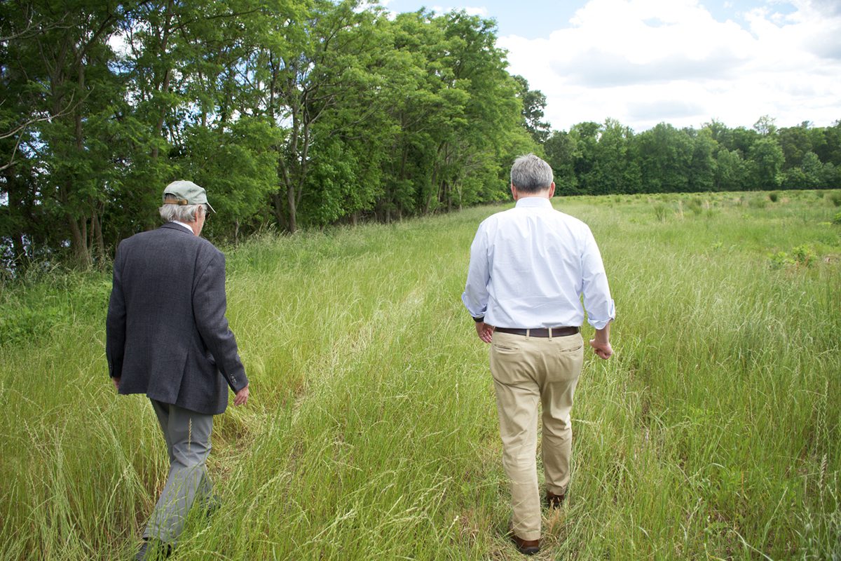 Retired East Carolina University geologist Dr. Stan Riggs, left, and Attorney General Josh Stein discuss the ecological and geographic history of the Tall Glass of Water site in Bertie County during a recent event. Photo: Kip Tabb