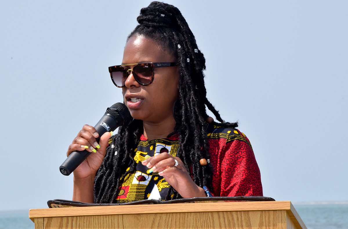 Tyisha Teel of Beaufort speaks Saturday during the ceremony at Shell Point, across from the Cape Lookout National Seashore visitor center on Harkers Island. Photo: Mark Hibbs