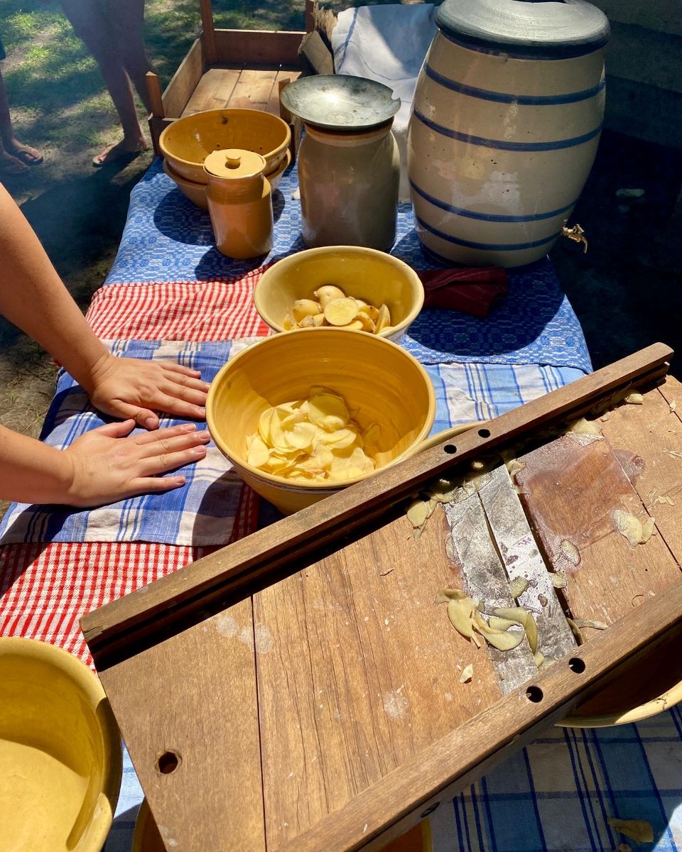 Potatoes are prepared during a past Tater Day, part of Island Farm's historic food series by Island Farm on Roanoke Island. Photo: Island Farm