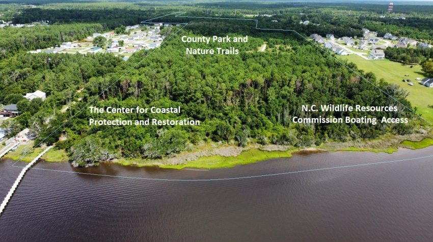 An aerial view of the 77-acre site, with Bogue Sound in the foreground and Highway 24 in the distance, shows the location of the future Center as well as the nature trails, County Park, and boat ramp. Graphic: N.C. Coastal Federation