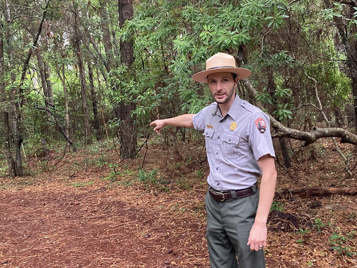 Fort Raleigh lead park ranger Josh Nelson points toward the future site of an exhibit along the planned Freedom Interpretive Trail. Photo: Catherine Kozak