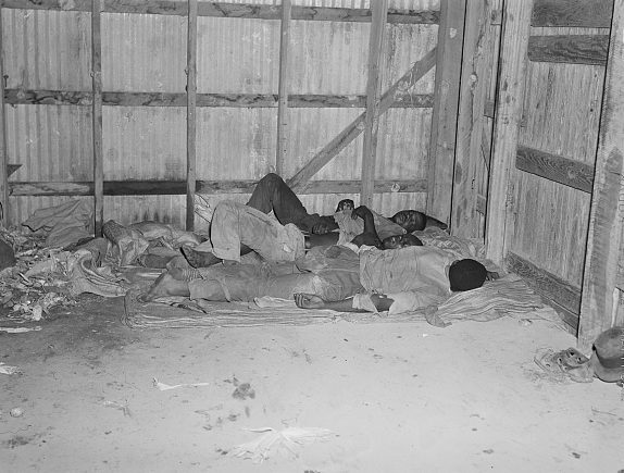 Belcross, N.C., 1940. Some of the farm workers stayed in old farmhouses, some in tents, some in boardinghouses in Elizabeth City’s African American neighborhoods. Others just slept in the potato warehouse. Photo by Jack Delano. Courtesy, Library of Congress

