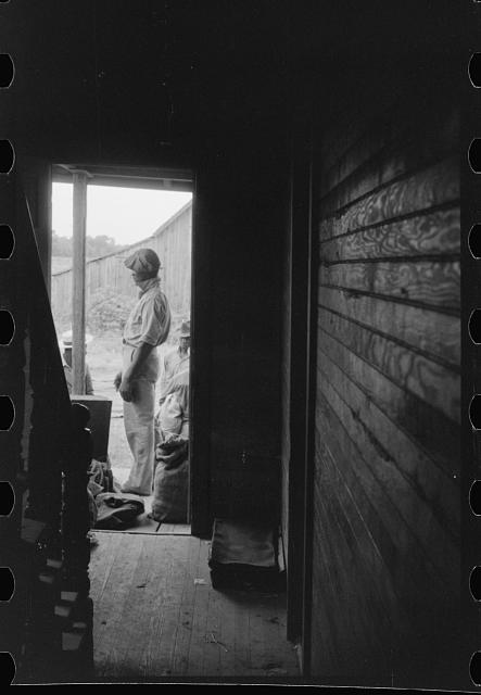 Field worker at a camp in Belcross, N.C., 1940. He and 30-some other laborers in the camp had just finished the potato harvest and were waiting for a truck to pick them up to go to another job on Virginia’s Eastern Shore. Photo by Jack Delano. Courtesy, Library of Congress