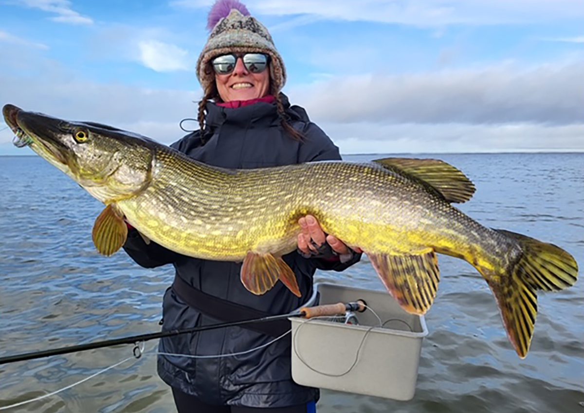 Kristi Irvin of Kitty Hawk shows off a huge northern pike. Photo: Contributed